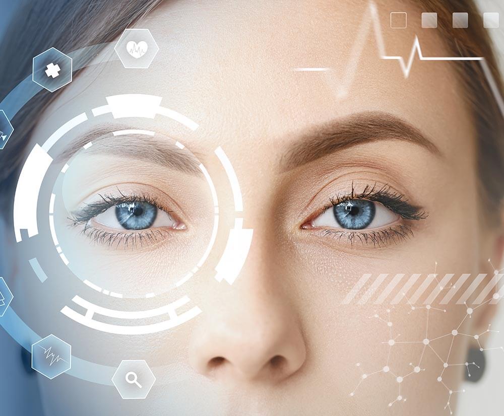 Woman with blue eyes has futuristic graphics on her face