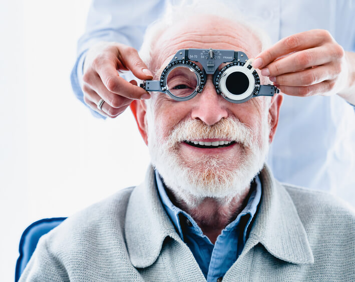 Smiling older man having a cataract exam