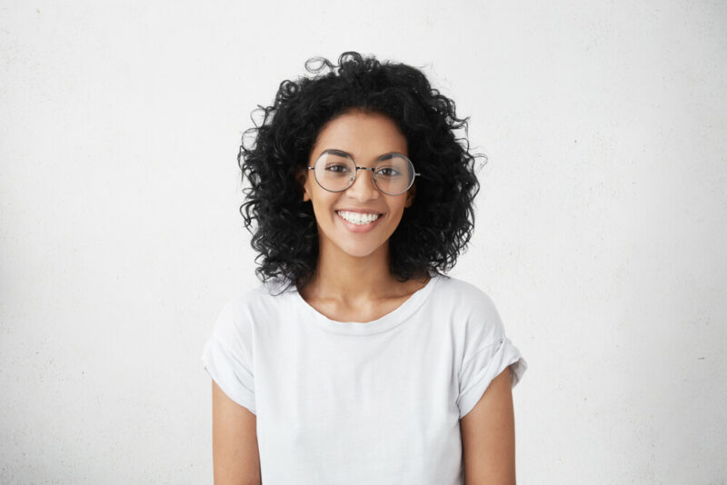 Smiling young woman with glasses