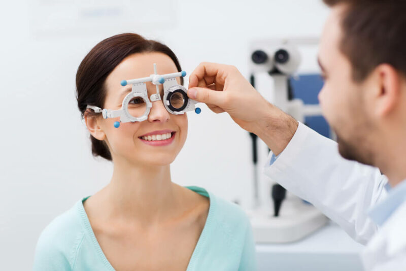 Smiling woman having an eye exam